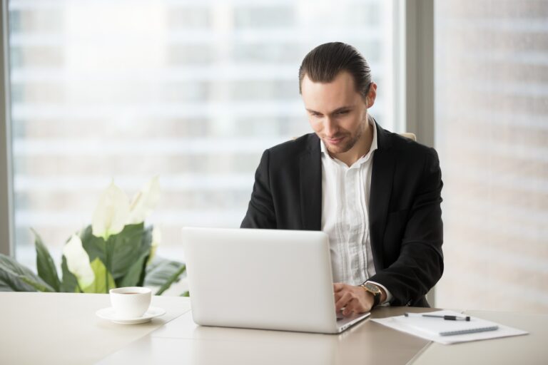 A man is working on the laptop