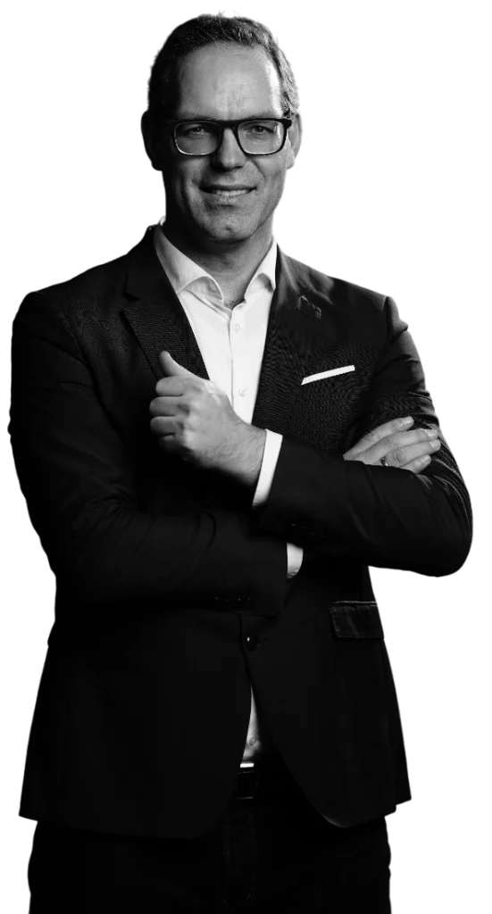 Confident business executive in suit with arms crossed