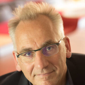Portrait of a smiling middle-aged man wearing glasses