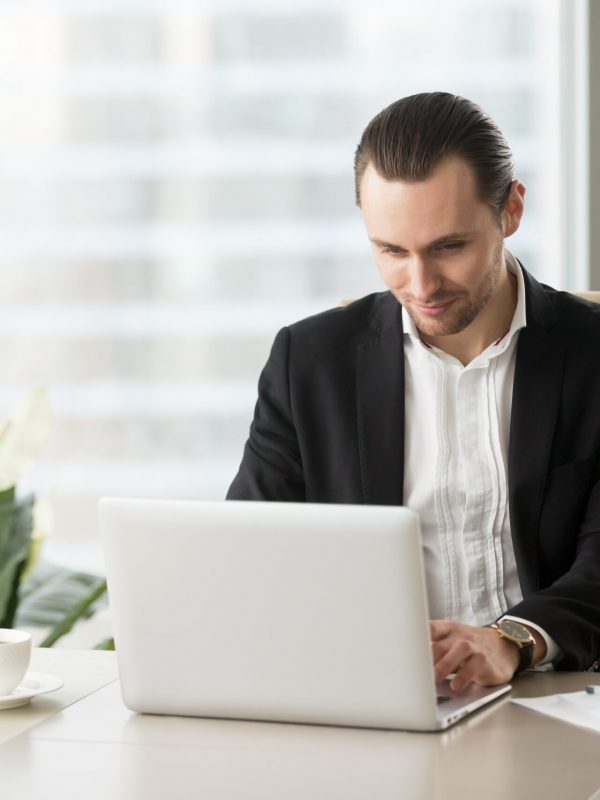 A man is working on the laptop